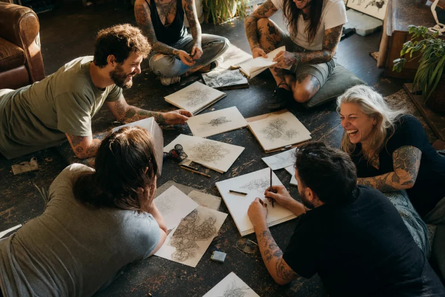 Tattoo artists having a candid studio hangout